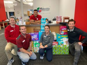 Lincoln staff with diaper donations- engaging in the Lincoln community